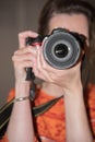 Female Photographer at work with camera Royalty Free Stock Photo