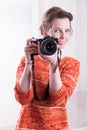 Female Photographer at work with camera Royalty Free Stock Photo