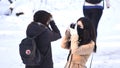 Female Photographers Taking Photos During a winter Tour