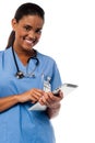 Female physician browsing on tablet pc