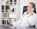 Female Physician on Chair Calling on Mobile Phone