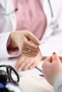 Female physician hand give white blank Royalty Free Stock Photo