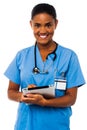 Female physician holding tablet pc