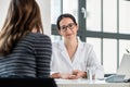 Female physician listening to her patient during consultation Royalty Free Stock Photo