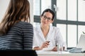 Female physician listening to her patient during consultation Royalty Free Stock Photo