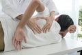 Female physiotherapists provide physical assistance to male patients with back injuries back massages for relaxation and muscle