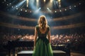 Female pianist in a green dress standing in front of the concert hall, Back view of a girl in a green evening dress set against