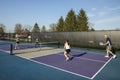 Female Pickleball Player Returning Ball