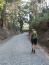 Female pilgrim with a backpack on a forest track Royalty Free Stock Photo