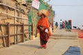 Female Pilgrim Carries Bundle On Her Head on Way to Next Temple Royalty Free Stock Photo