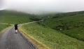 Female Pilgrim walking the Camino up the Pyrenees in France