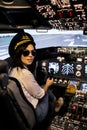 Female pilot the captain of the plane prepares for take-off in the plane cockpit. Royalty Free Stock Photo