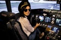 Female pilot the captain of the plane prepares for take-off in the plane cockpit.