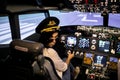 Female pilot the captain of the plane prepares for take-off in the plane cockpit. Royalty Free Stock Photo