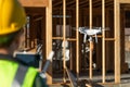 Female Pilot Flies Drone Quadcopter Inspecting Construction Site Royalty Free Stock Photo