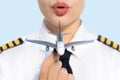 Pretty pilot captain woman and airplane at the airport. Aviation commercial Royalty Free Stock Photo