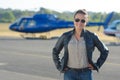 Female pilot posing in tarmac