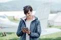 Female pilot using a tablet Royalty Free Stock Photo