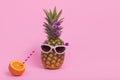 Female pineapple hipster in sunglasses with  fresh orange juice Royalty Free Stock Photo