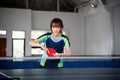 female ping pong athlete holding ball preparing to serve Royalty Free Stock Photo