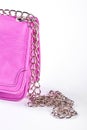 Female pink bag with chain.