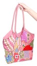Female pink bag with embroidery in hand Royalty Free Stock Photo