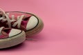 Female Pink canvas vintage styled sneakers basketball shoes, dirty Royalty Free Stock Photo