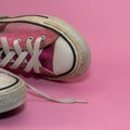 Female Pink canvas vintage styled sneakers basketball shoes, dirty Royalty Free Stock Photo