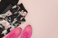 Female pink sneakers, sport shoes, leggings in flat lay style, top view. Fitness concept, active lifestyle, body care concept. Cop