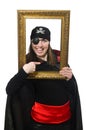 Female pirate in black coat holding photo frame Royalty Free Stock Photo