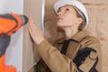 Female plasterer at indoor wall work Royalty Free Stock Photo