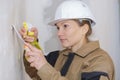 Female plasterer at work