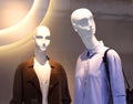 Female plastic mannequins behind a fashion store window Royalty Free Stock Photo