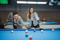 female player pointing on the white ball to directing the male player Royalty Free Stock Photo