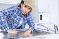 female plumber fitting kitchen sink