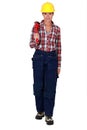 Female plumber holding wrench Royalty Free Stock Photo