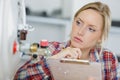 Female plumber inspecting boiler Royalty Free Stock Photo