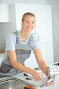 female plumber installing tap Royalty Free Stock Photo