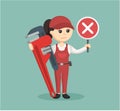 Female plumber standing with cross sign