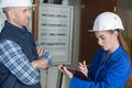 Female plumber working on central heating boiler Royalty Free Stock Photo