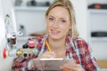 Female plumber working on central heating boiler Royalty Free Stock Photo