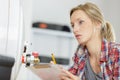 female plumber working on central heating boiler Royalty Free Stock Photo