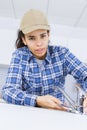 Female plumber working on sink using wrench Royalty Free Stock Photo