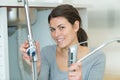 female plumber working on sink using wrench Royalty Free Stock Photo