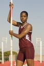 Female Pole Vaulter Standing With Pole