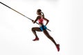 Female pole vaulter training on white studio background