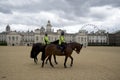 Female police riding horse in London England