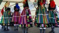 Female polish dancers in traditional folklore costumes on stage
