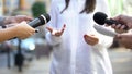 Female politician talking on media press conference, public relations, event Royalty Free Stock Photo