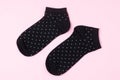 Female Polka Dots Black Sockson Pink Background Horizontal Top View